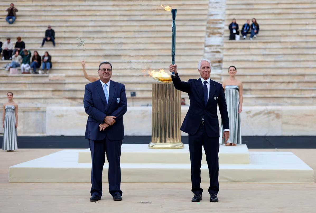 Olympic flame handed over in Athens as it begins journey to Italy for Milano Cortina 2026